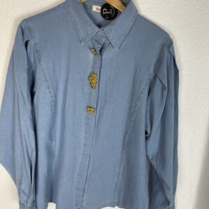 CAMISA VAQUERA CLARA DETALLE BOTONES Y MANGAS ABULLONADAS